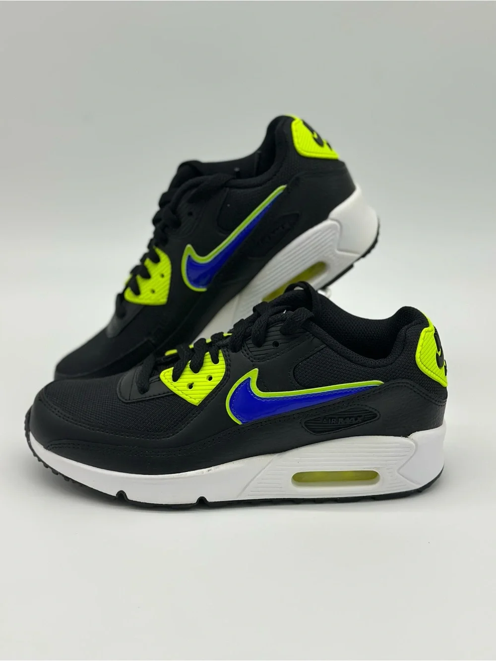 Nike Kids Black Sneakers with Neon Yellow and Blue Swoosh